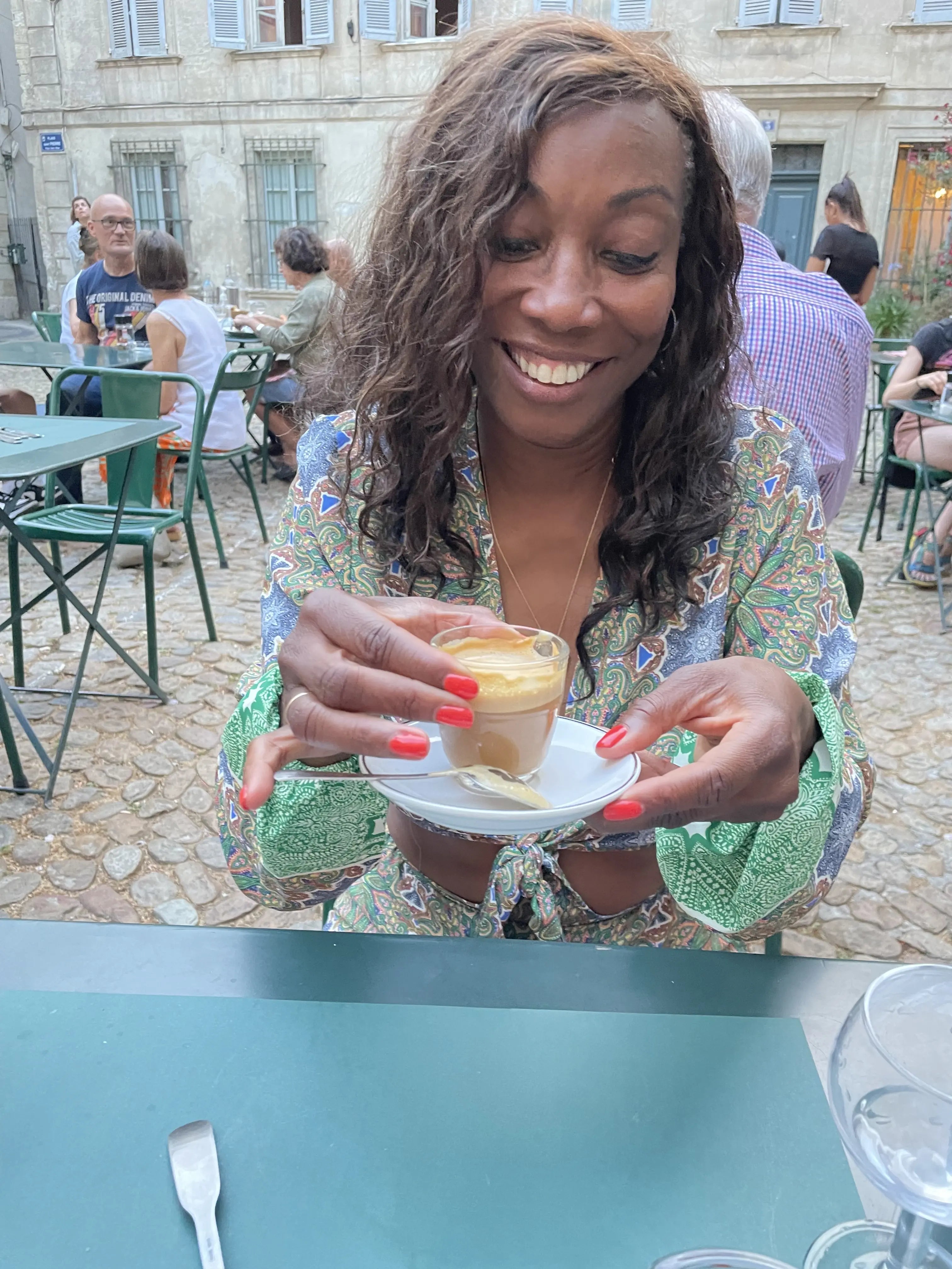 Melicent enjoys a cafe latte