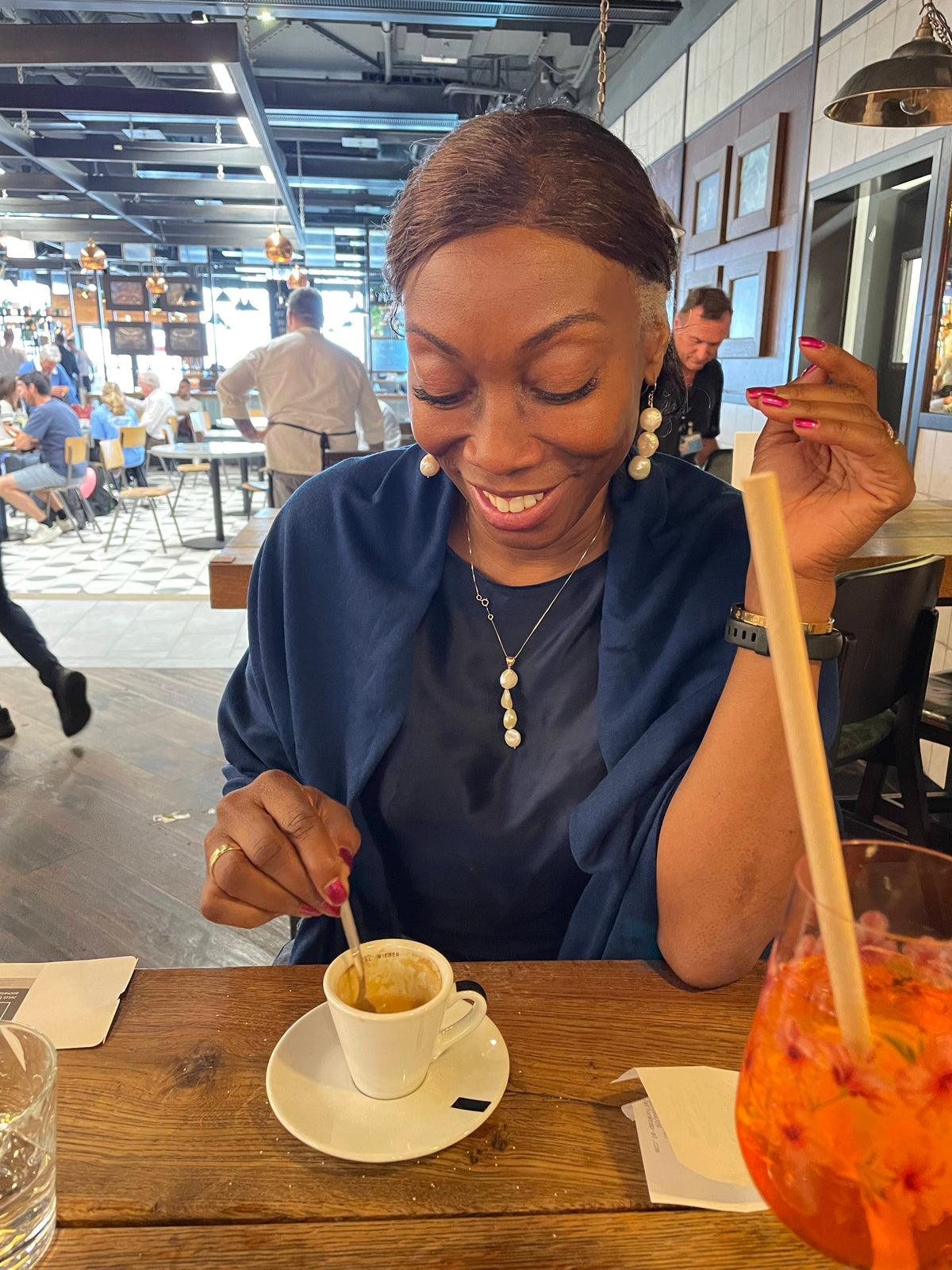 Melicent smiling at her ristretto shot in Italy