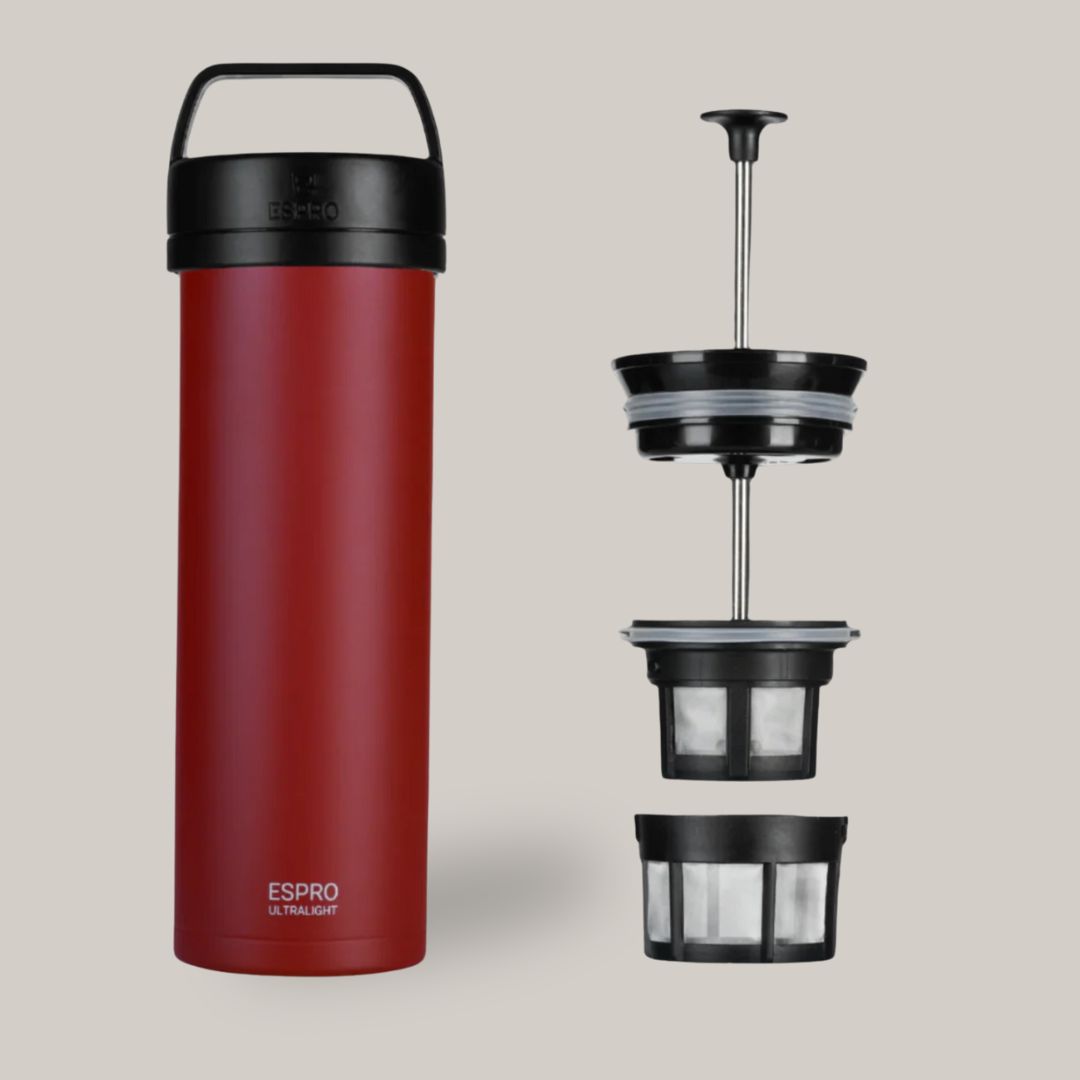 Red portable french press coffee maker with components