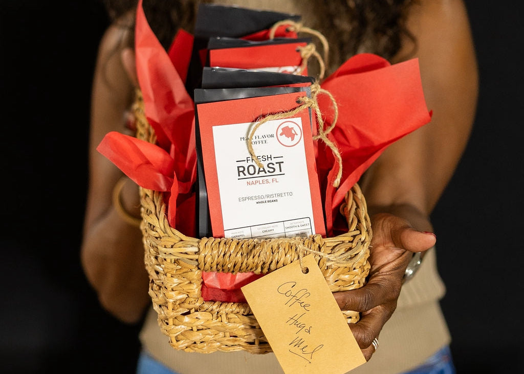 Melicent holds an espresso sampler coffee gift