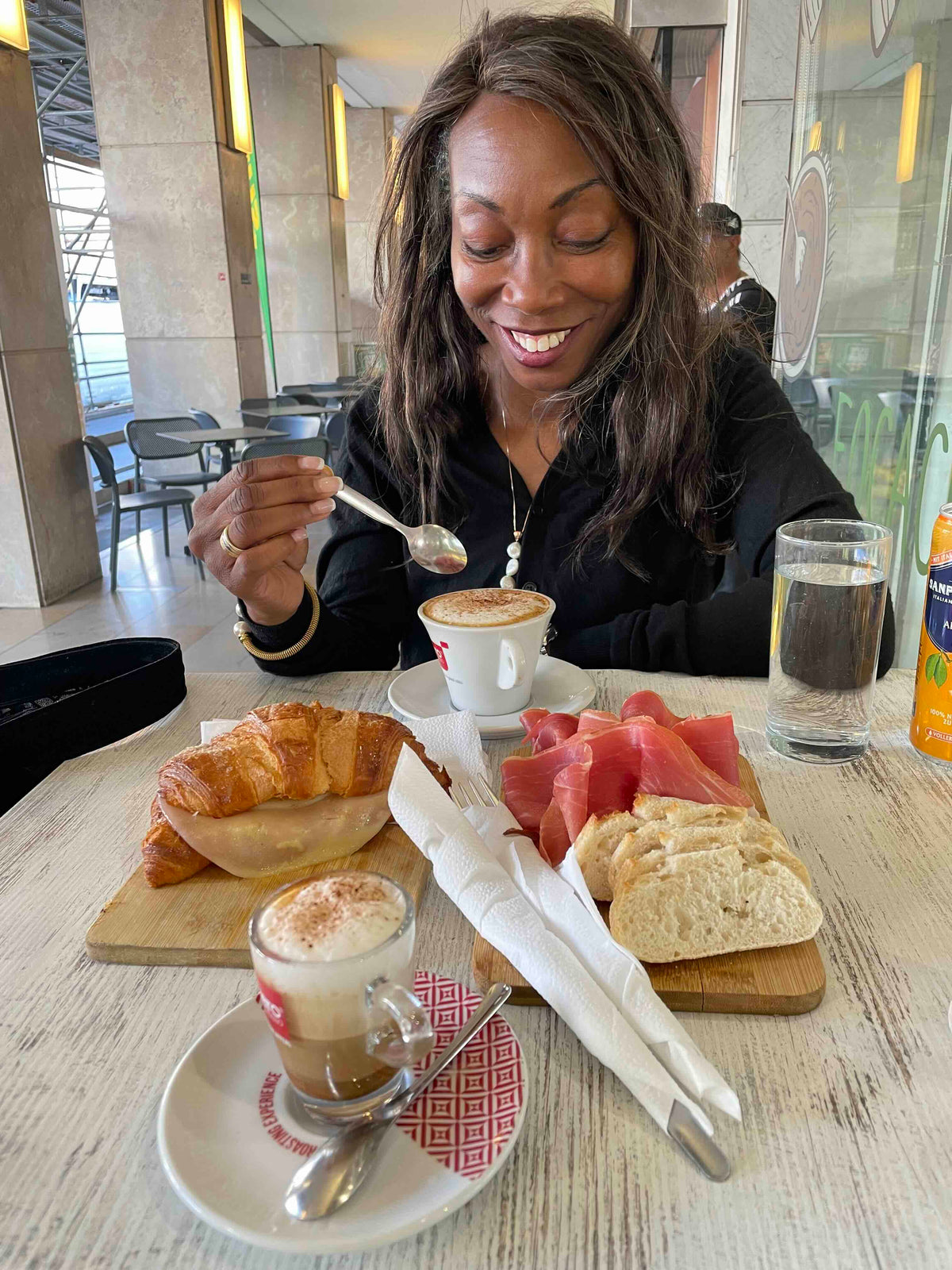 Melicent enjoys Italian cappuccino
