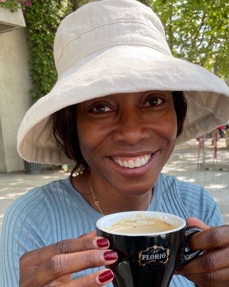 Melicent drinks mild coffee in Italy