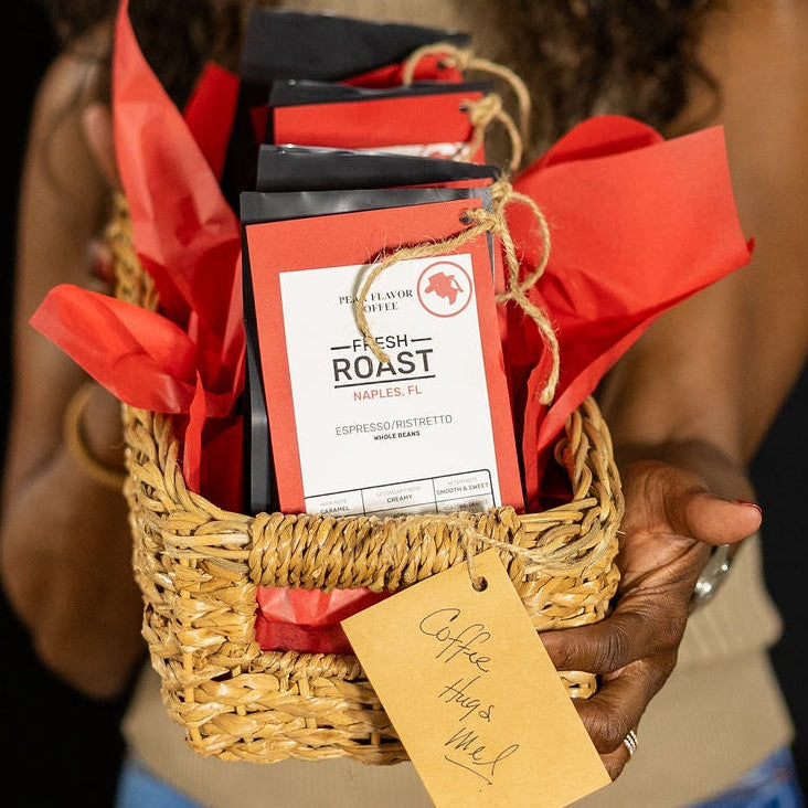 Melicent holds an espresso sampler coffee gift