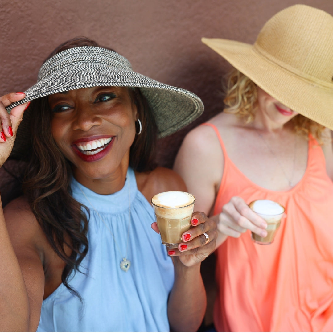 Melicent enjoys peak flavor cafe latte with a friend