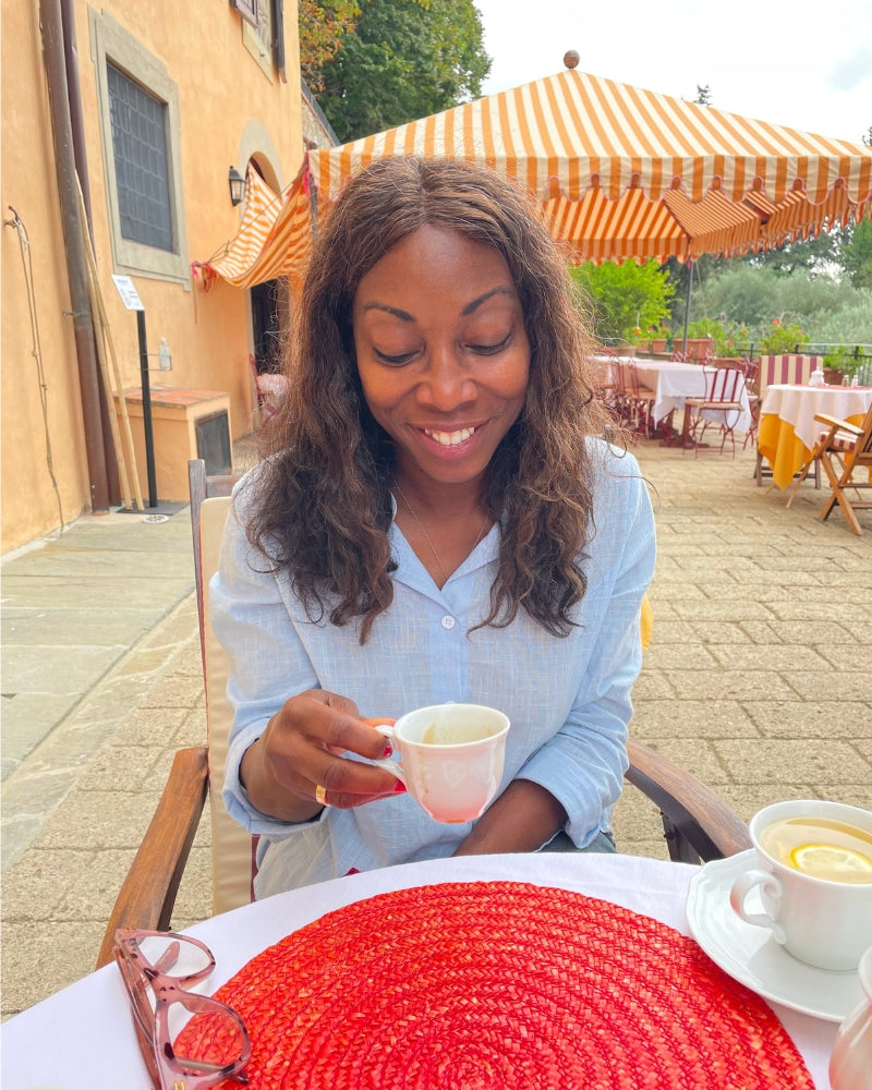 Melicent enjoys cappuccino in Italy