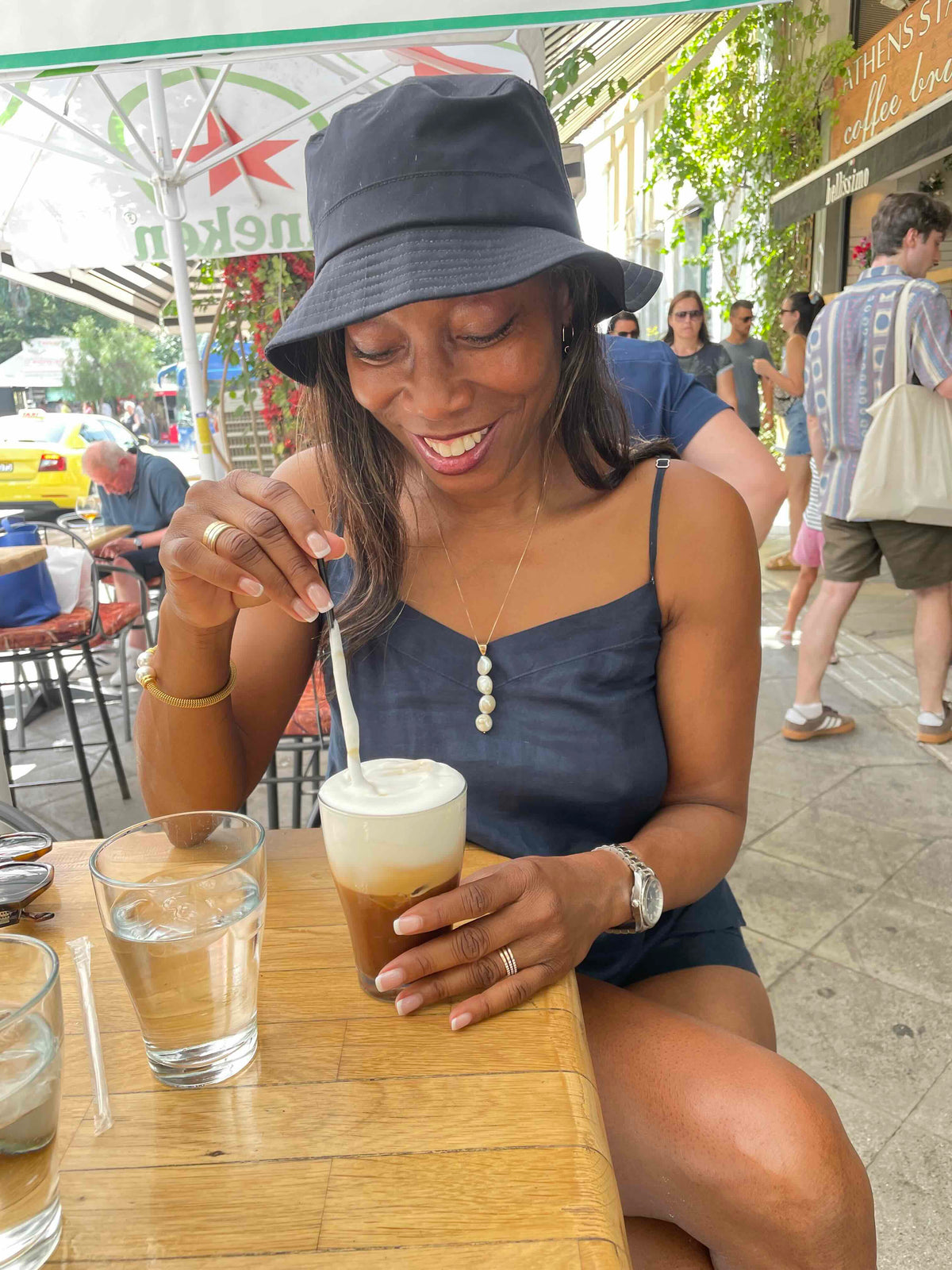 Melicent enjoys iced cappuccino in Greece